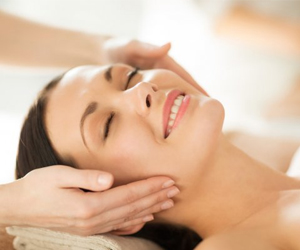 a woman receiving a shoulder massage