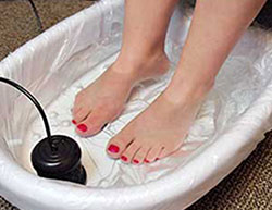 a person bathing their feet