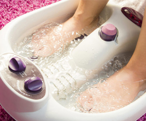 a person receiving a foot bath
