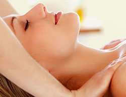 a woman receiving a shoulder massage